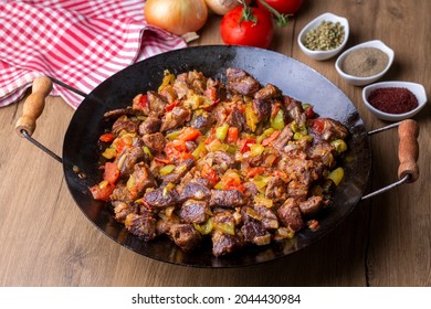 Meat saute in traditional pan - Sac kavurma, Turkish Food - Shutterstock ID 2044430984