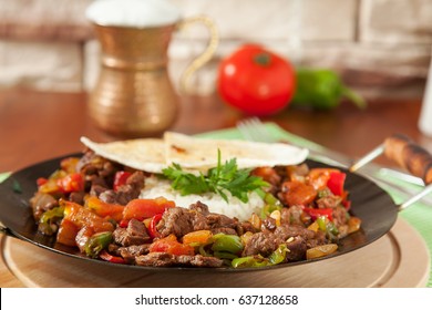 Meat Saute Turkish Et sote with wooden table - Hair Pie Meat - Sac Tava - Sac Kavurma - Shutterstock ID 637128658