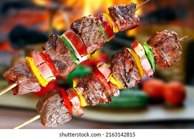 Meat skewer with bacon and vegetables