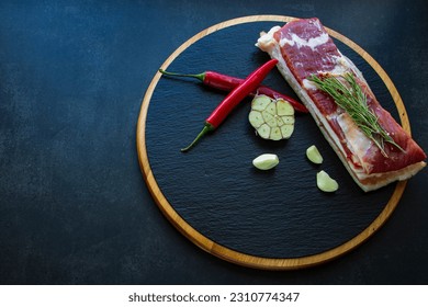 Meat. Meat with spices on a stone board - Shutterstock ID 2310774347