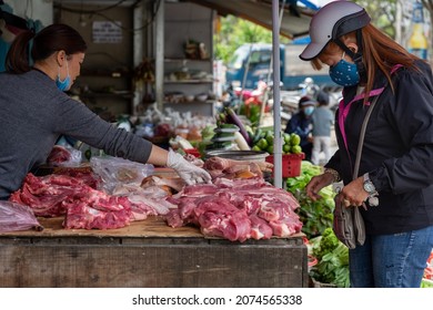 Meat Stall In The Street Market. Woman Buys Pork. Da Lat, Vietnam: 2021-05-08