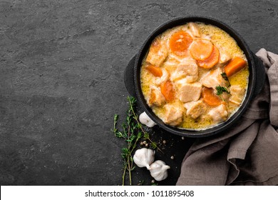 Meat Stew, Chicken Fillet In Sauce With Carrot In A Cast Iron Pot, Top View