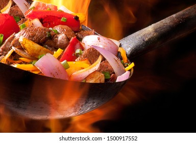 meat and vegetables cooked in wok