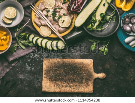 Similar – Foto Bild Hähnchenspieße mit Zucchini und Paprika zubereiten