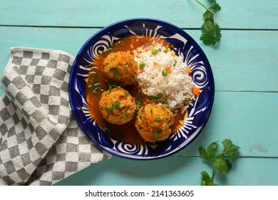 Meatballs With Chipotle Red Sauce And Rice. Traditional Mexican Food