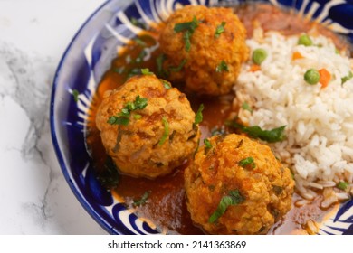 Meatballs With Chipotle Red Sauce And Rice. Traditional Mexican Food