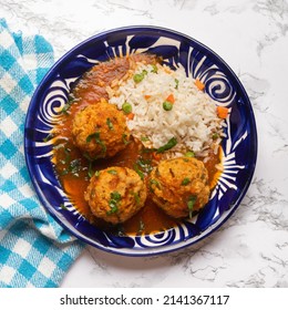 Meatballs With Chipotle Red Sauce And Rice. Traditional Mexican Food