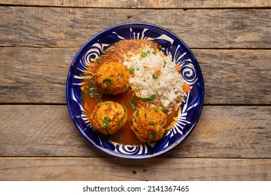 Meatballs With Chipotle Red Sauce And Rice. Traditional Mexican Food