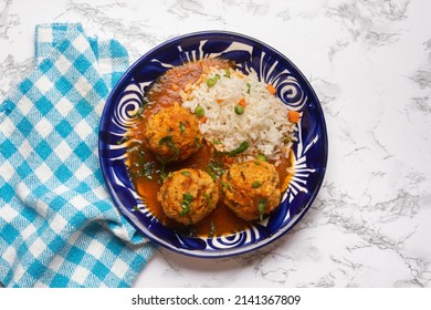 Meatballs With Chipotle Red Sauce And Rice. Traditional Mexican Food