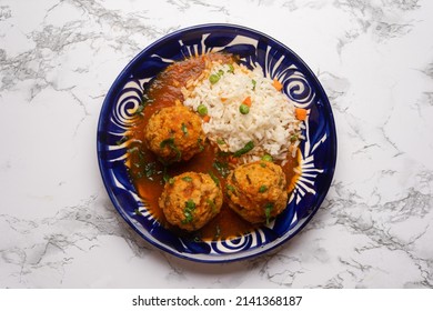 Meatballs With Chipotle Red Sauce And Rice. Traditional Mexican Food