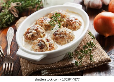 Meatballs With Rice In A Creamy Sauce On The Table