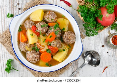 Meatballs in a thick vegetable soup Albondigas. Mexican and Spanish cuisine