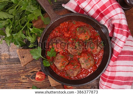 Image, Stock Photo Meatballs in tomato sauce on black tray. Above view of meat dish