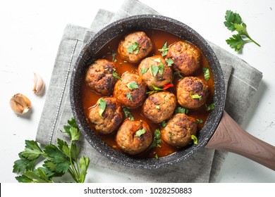 Meatballs In Tomato Sauce In A Frying Pan Top View. 