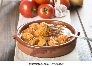 Meatballs with tomato sauce on the table of the kitchen - Powered by Shutterstock