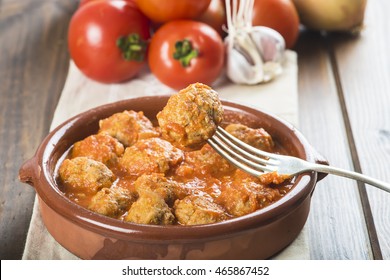 Meatballs with tomato sauce on the table of the kitchen - Powered by Shutterstock