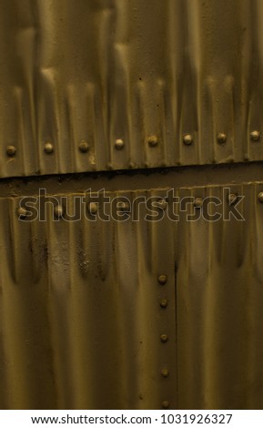 Meatl plate of metal wall in colour of camo green. Military airdrom with this walls Stock photo © 