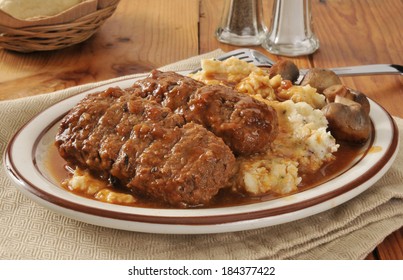 Meatloaf With Mashed Potatoes, Gravy And Sauteed Mushrooms