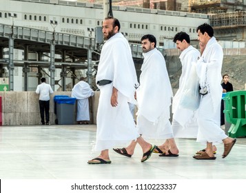 MECCA, SAUDI ARABIA - JAN 28: Muslim wearing ihram clothes and ready for Hajj on January 28, 2017 in Mecca, Saudi Arabia. Muslims all around the world face the Kaaba during prayer time.