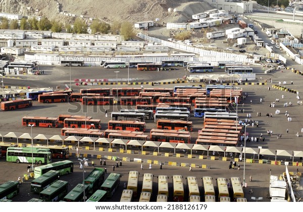 Mecca, Saudi Arabia -July\
3,2022: An aerial view of open air bus station in Mecca, Saudi\
Arabia. 