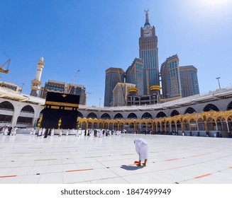 MECCA , SAUDI ARABIA , OCT/22/2020 - Pilgrims Circle The Kaaba At Masjid Al-Haram - Umrah Fewer Muslims People Socially Distanced Corona Virus Wearing Face Mask Covid 19