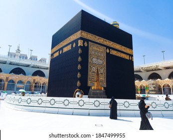 MECCA , SAUDI ARABIA , OCT/22/2020 - Pilgrims circle the Kaaba at Masjid al-Haram - umrah Fewer Muslims people Socially Distanced corona virus wearing face mask Covid 19