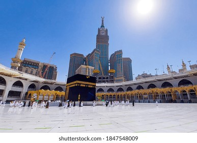 MECCA , SAUDI ARABIA , OCT/22/2020 - Pilgrims Circle The Kaaba At Masjid Al-Haram - Umrah Fewer Muslims People Socially Distanced Corona Virus Wearing Face Mask Covid 19