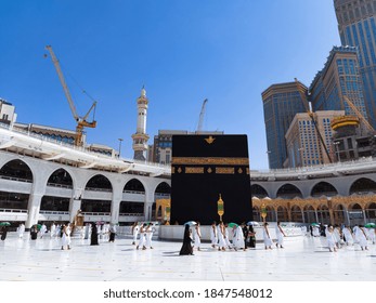 MECCA , SAUDI ARABIA , OCT/22/2020 - Pilgrims Circle The Kaaba At Masjid Al-Haram - Umrah Fewer Muslims People Socially Distanced Corona Virus Wearing Face Mask Covid 19