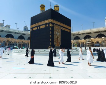 MECCA, SAUDI ARABIA , OCTOBER 22, 2020 - The Holy Kaaba - Pilgrims return to Mecca for limited umrah as  coronavirus restrictions - face mask wearing Muslims perform umrah  in Makka