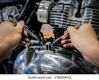 Mechanic Is Adjusting Motorcycle Clutch Cable