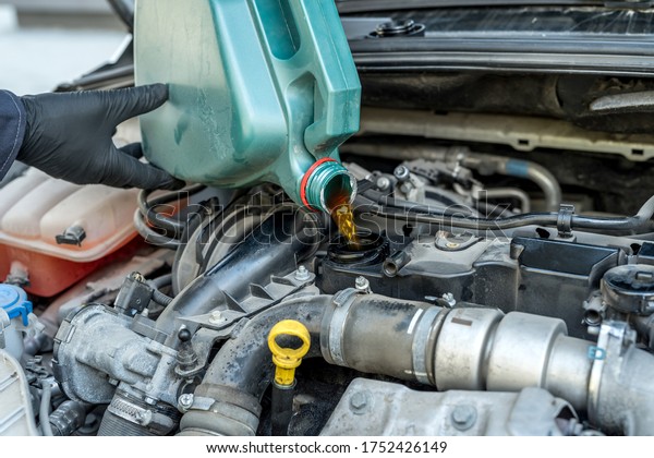 mechanic change oil to engine, car servicing.\
vichile repair