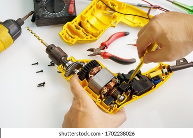 Mechanic to change switches for electric drill ,Old drill start to wear out after used for a long time                               - Powered by Shutterstock