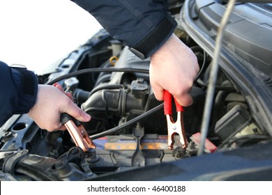 Mechanic Changing The Battery Of A Car