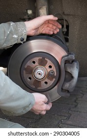A mechanic is changing a wheel of a modern car - Shutterstock ID 290304005
