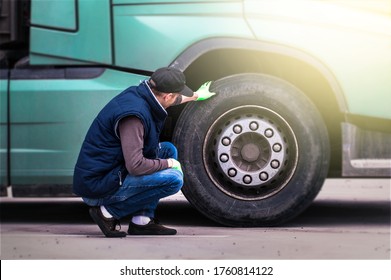 Mechanic Check And Analyzing The Tire Truck. Banner Concept.