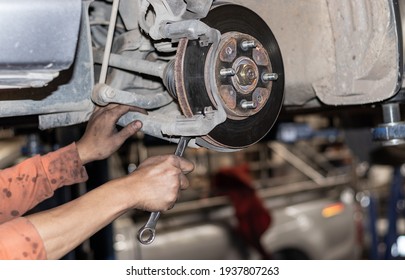 The mechanic is checking the engine. - Shutterstock ID 1937807263