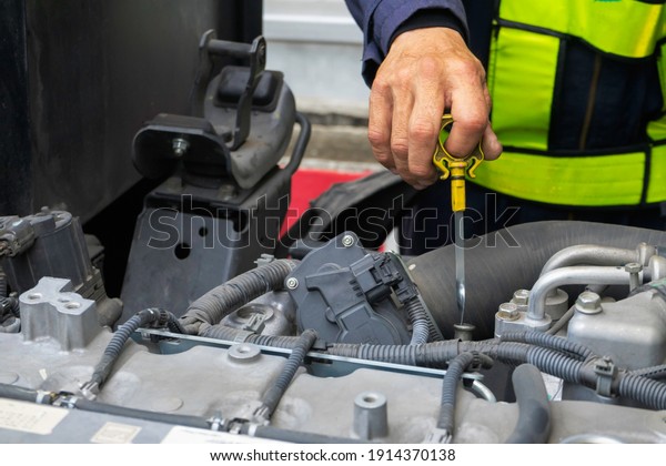 The mechanic is checking the engine to be\
in good condition and always ready to\
use.