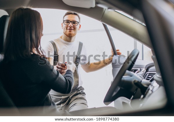 Mechanic with client
in car service station
