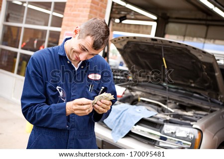 Mechanic: Counting money from repairs.
