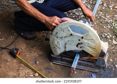 The Mechanic Was Cutting The Steel, Causing A Spark. Steel Cutting Machine