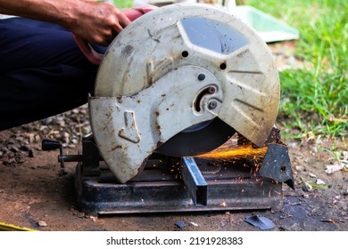 The Mechanic Was Cutting The Steel, Causing A Spark. Steel Cutting Machine