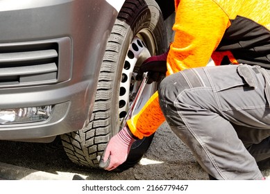 Mechanic, Driver Replaces The Car Wheel. Car Repair Garage In Your Home.