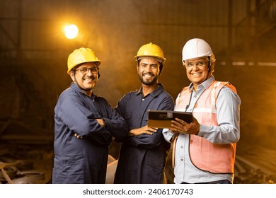 Mechanic with engineer using digital tablet and discussing at factory - Powered by Shutterstock