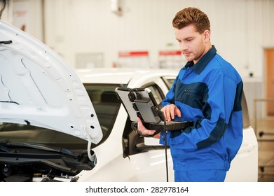 Mechanic Examining Car Confident Young Man Stock Photo 282978164 ...