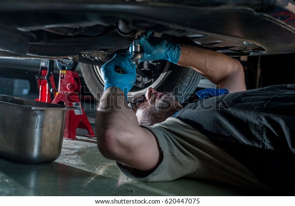 mechanic fixing a car at\
home	