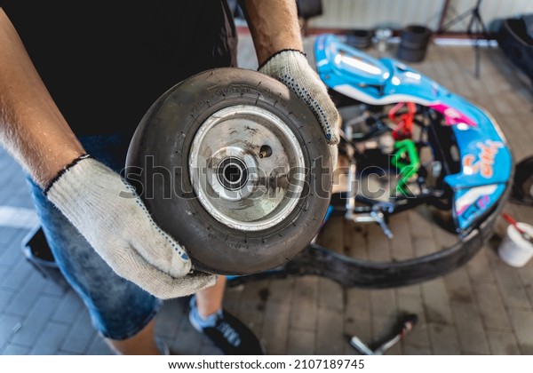 The\
mechanic go kart racing service change the\
wheels