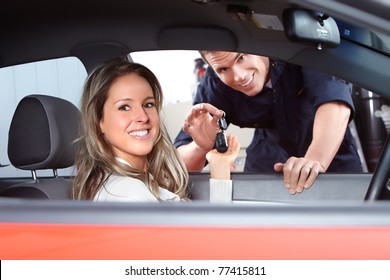 Mechanic Handing Woman Automobile Keys. Auto Repair