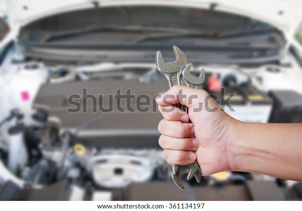 Mechanic Holding\
Spanner Fixing Car\
Engine