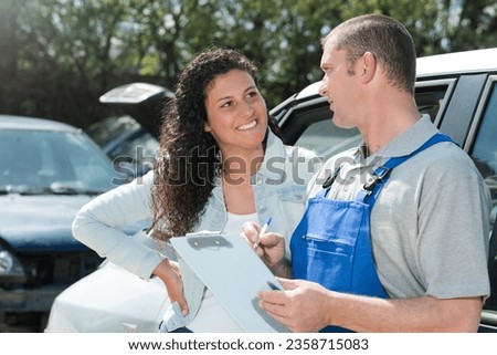 mechanic inspecting a vehicle for sale
