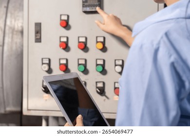 Mechanic or maintenance or electrical engineer checking main electrical control systems industrial plant. Utility fore man daily check power systems in process. Main Distribution Board, Switchboards